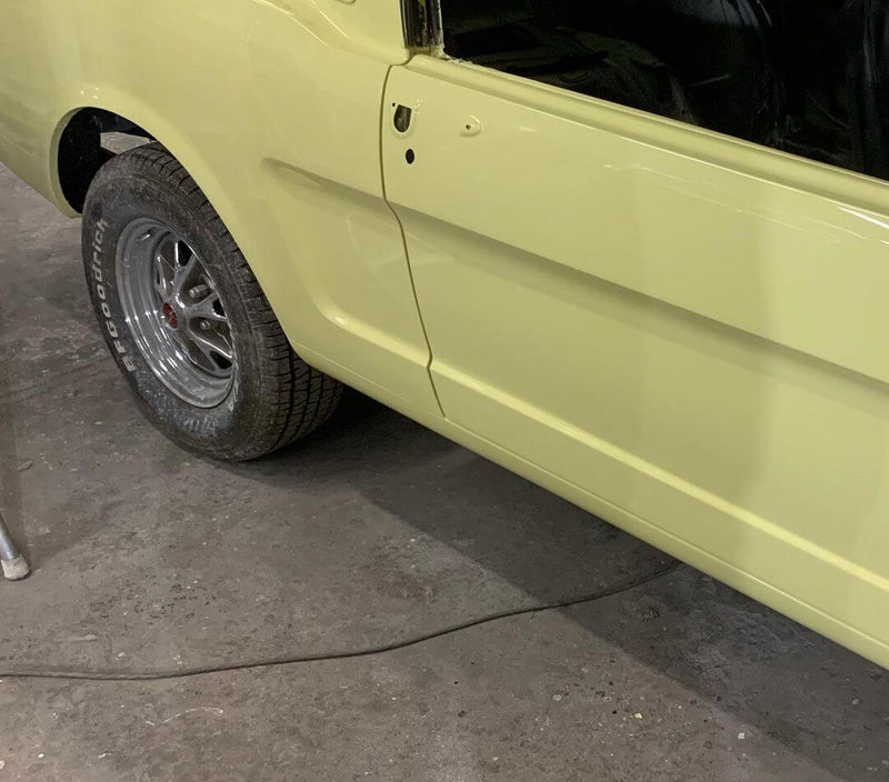 SPRINGTIME YELLOW PARTS OF THE CAR OF  1966 FORD MUSTANG