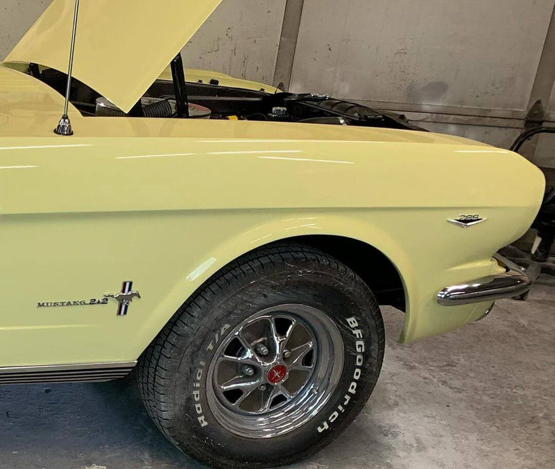 SPRINGTIME YELLOW PARTS OF THE CAR OF  1966 FORD MUSTANG