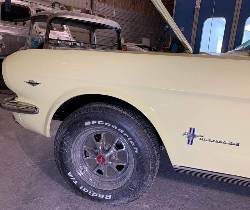 SPRINGTIME YELLOW PARTS OF THE CAR OF  1966 FORD MUSTANG